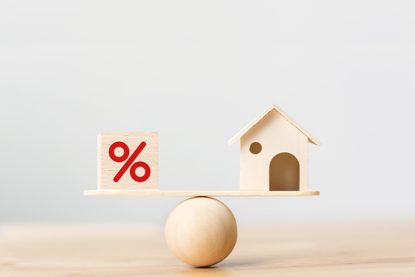 interest rates with house balancing on an egg